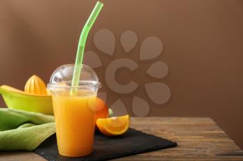 Cup of freshly squeezed orange juice on table�