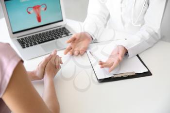 Gynecologist working with patient in office�