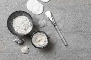 Cosmetic clay with brush on grey table�