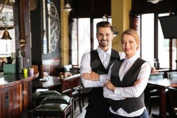 Young waiters in restaurant�