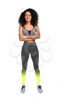 Sporty African-American woman on white background�
