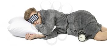 Sleeping man with mask and pillow on white background�