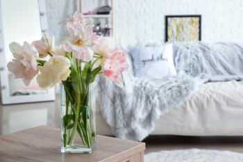 Bouquet of beautiful tulips on table in room�