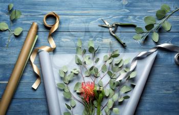 Workplace of professional florist on wooden background�