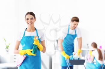 Female janitor and her team in office�