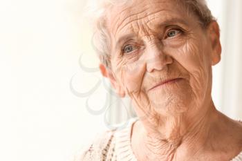 Portrait of senior woman at home�