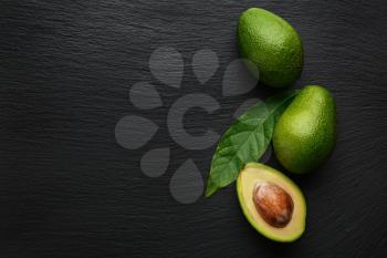 Fresh avocado on dark background�