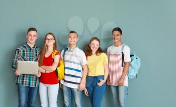Group of teenagers on color background�