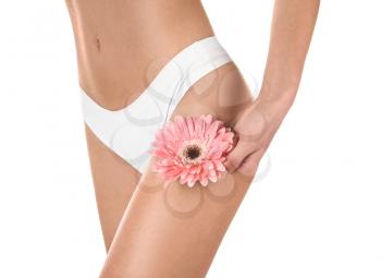 Beautiful young woman with flower on white background. Epilation concept�