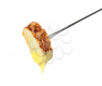 Fondue stick with cheese covered piece of bread on white background�