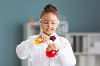 Little African-American scientist in laboratory�