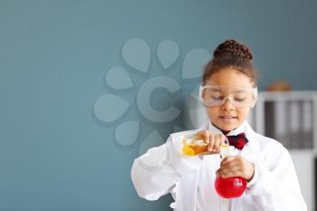 Little African-American scientist in laboratory�