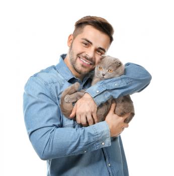 Young man with cute funny cat on white background�