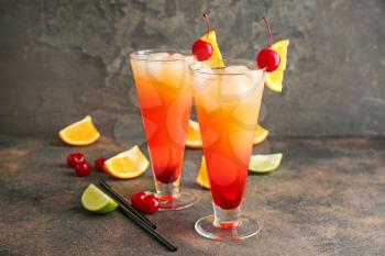Glasses of Tequila Sunrise cocktail on table�