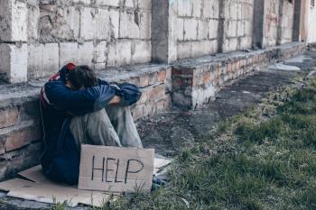 Poor homeless man begging for help outdoors�
