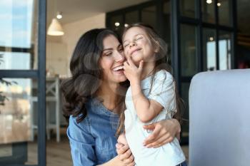 Portrait of happy mother and daughter at home�