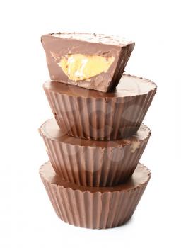 Tasty chocolate peanut butter cups on white background�