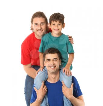Happy gay couple with adopted child on white background�