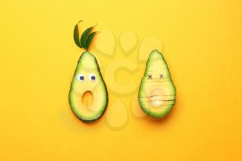 Creative composition with avocado on color background�