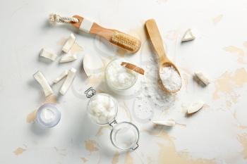 Composition with coconut body scrub on light background�