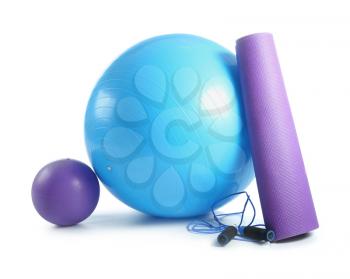 Set of sports equipment with fitness ball on white background�