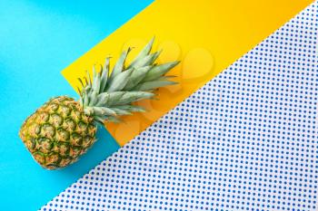 Ripe pineapple on color background�