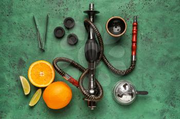 Parts of hookah and fruits on color background�