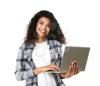 Portrait of cute African-American woman with laptop on white background�