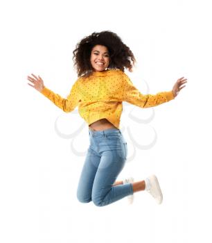 Jumping African-American woman on white background�