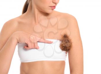 Beautiful young woman with imitation of hair under arm on white background. Depilation concept�