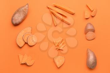 Fresh sweet potatoes on color background�