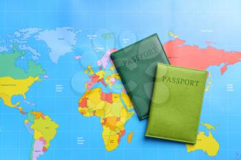 Two passports on world map. Concept of immigration�
