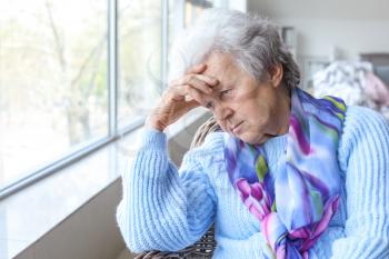 Portrait of sad senior woman in nursing home�