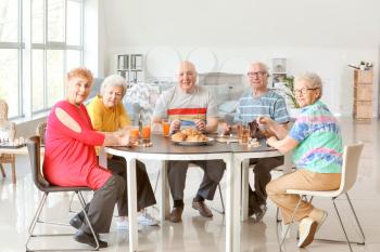 Group of senior people spending time together in nursing home�