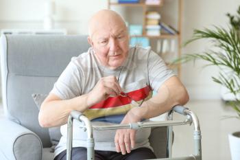 Portrait of sad senior man in nursing home�