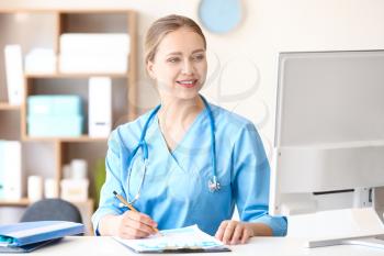 Young medical assistant working in clinic�
