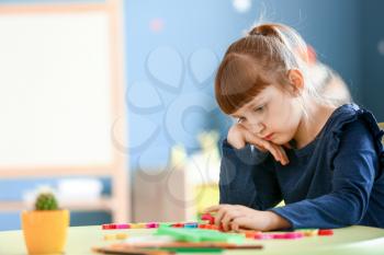 Little girl with autistic disorder in playroom�
