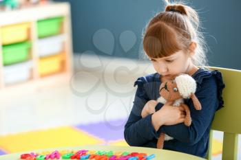 Little girl with autistic disorder in playroom�