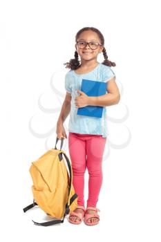 Adorable little African-American schoolgirl on white background�