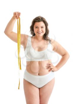 Plus size woman with measuring tape on white background. Concept of body positive�