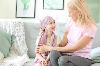 Little girl after chemotherapy with her grandmother at home�