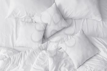 Soft pillows on bed, top view�