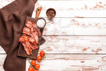 Fried bacon with spices on white table�