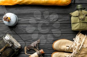 Set of items for camping on wooden background�