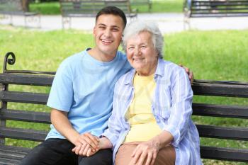 Grandson with senior woman in park�