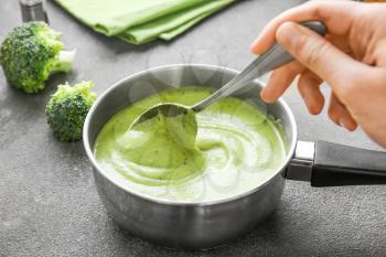 Cooking of delicious cream soup in saucepan�