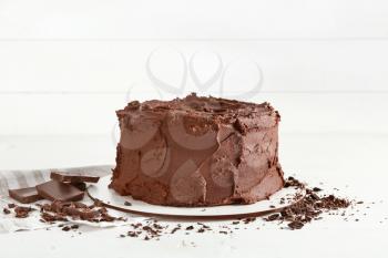 Tasty chocolate cake on white background�