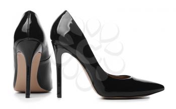 Stylish high-heeled female shoes on white background�