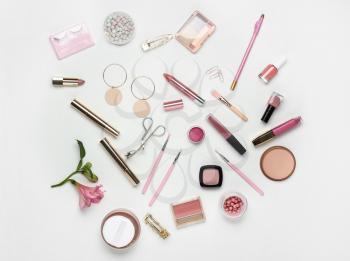 Set of decorative cosmetics and accessories on white background�