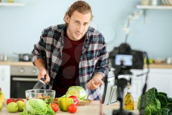 Food blogger recording video at home�